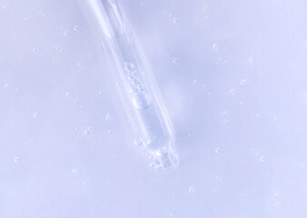 glass pipette serum closeup on a light background	

