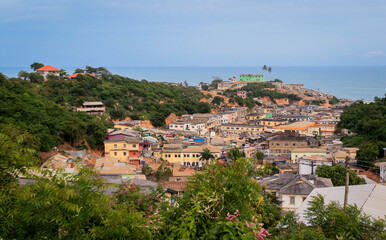 Fototapeta na wymiar Panoramic View to the Cape Coast Downtown Houses among Green Trees in Ghana, West Africa 