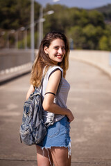 Fototapeta premium Portrait of a girl in short jeans.