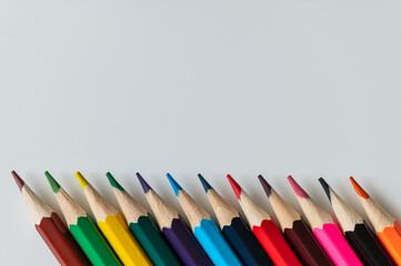 Various colored wooden pencils of different colors sorted