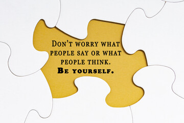 Motivational quote on jigsaw puzzle with some missing pieces.