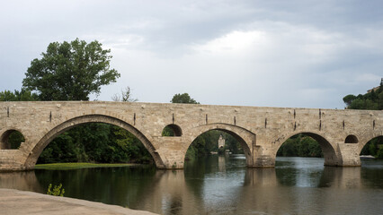 Fototapeta na wymiar retail of old restored roman bridge in Beziers the city in south France