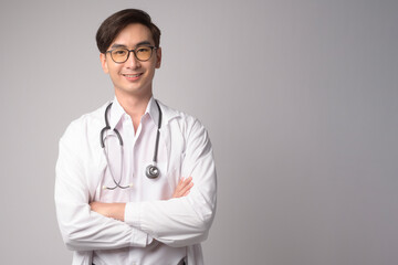 Fototapeta premium Portrait of male confident doctor over white background studio, healthcare and Medical technology concept.