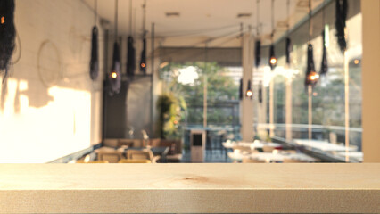Fototapeta na wymiar Wooden bar counter with defocused restaurant