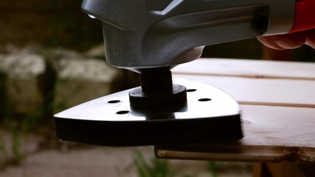 Using a power multi tool to sand wood