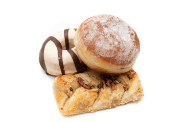 Cake still life. Donut, berliner (german doughnut) and sweet twisted puff pastry, isolated on white...
