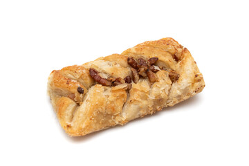 Sweet braided puff pastry isolated  on white background. Fresh phyllo pastry with jam inside and macadamia nuts close up.