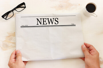 Top view image of empty newspaper over wooden table