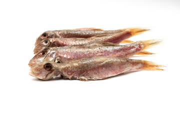 Raw and clean red mullet, isolated on white background. Mullus surmuletus is a bony fish, small in size, edible and highly appreciated. It is found throughout the Andalusian coast.