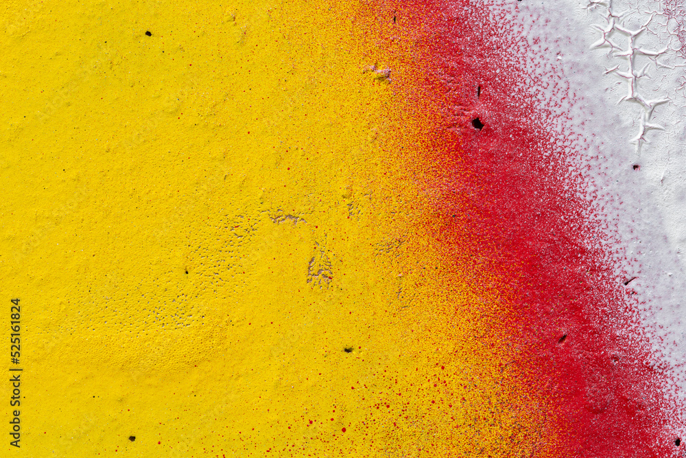 Poster macro close-up of a wall spray painted with yellow, red and white. abstract full frame textured spla