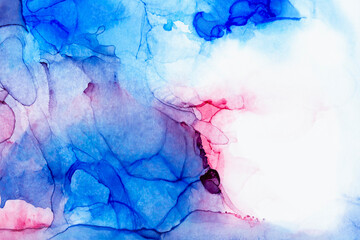 Macro close-up of blue and red alcohol ink layers and splashes, abstract background. Fluid ink,...