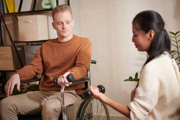 Caregiver Showing Exercise to Patient