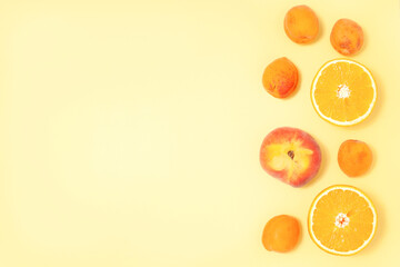 Yellow summer background with tropical fruits