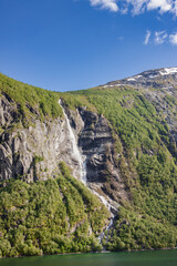 Obraz premium Beautiful and imposing Norwegian fjord in spring with its waterfalls