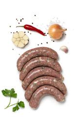 Turkey meat sausages with vegetables on white background. Top view.
