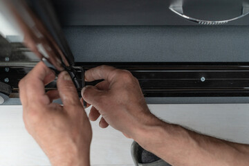 hexagonal key for adjusting the door in the closet, installation of the cabinet at home.