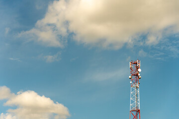 New GSM antennas on a high tower against a blue sky for transmitting a 5g signal are dangerous to health. Radiation pollution of the environment through cell towers. The threat of extinction