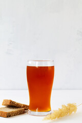 summer iced drinks. two high Glass of fresh kvass with bread on white background with copy space. vertical
