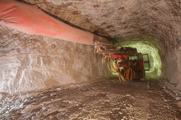 Obraz premium Drilling machine in deep salt mine.