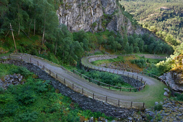 A hiking trail on the historic mesmerizing Vindhellavegen with several switchbacks / hairpin bends...