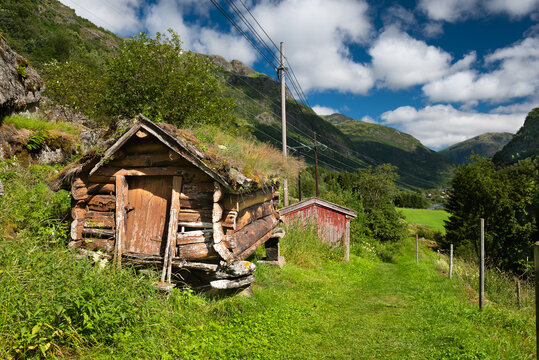 A hiking trail on the historic mesmerizing Vindhellavegen with several switchbacks / hairpin bends through the beautiful green hills of Borgund, Laerdal, Norway