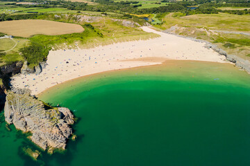 Aerial view of a huge sandy beach and clear waters (Broad Haven South, Pembrokeshire, Wales)