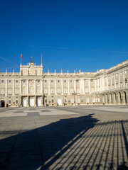Naklejka premium Madrid Royal Palace Plaza de la Armeria with gate shadow projected on the ground