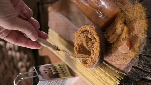 Bottarga, dried roe of mullet. Sardinian Food. FOR A dish with traditional Italian pasta from the South, dried sardine roe, and thin pasta. High quality FullHD footage