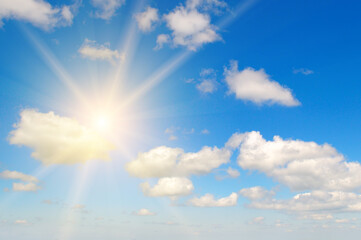 Naklejka na ściany i meble Beautiful, blue summer sky with fluffy clouds and bright sun