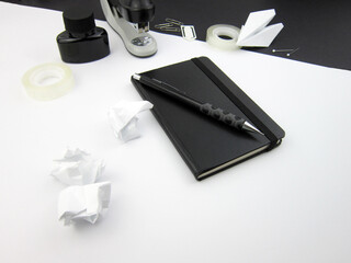    Creative trendy minimalist school or office workspace with black materials on a white...