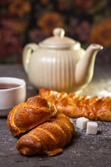 close-up fresh homemade buns with tea on the table