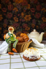 cinnabon bun with cinnamon and white cream at home on the table
