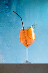 Classic italian aperitif aperol spritz cocktail in glass with ice cubes with slice of orange with...