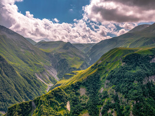 Amazing mountain landscape in Georgia on sunny summer day. Alpine green meadow in mountainous Caucasus. Idyllic valley in the Svaneti mountains.