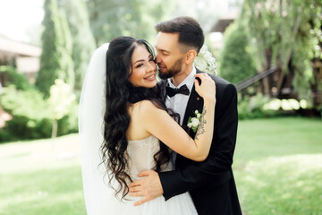 Amazing wedding couple. Beautiful bride and stylish groom