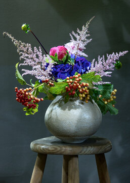 Beautiful purple hydrangea flowers in a vase on a table.Delicate floral arrangement. Close-up floral composition with a flowers. Soft focus.
