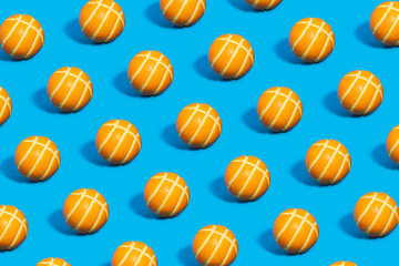 Pattern of a peeled orange in the shape of a basketball on a blue background.