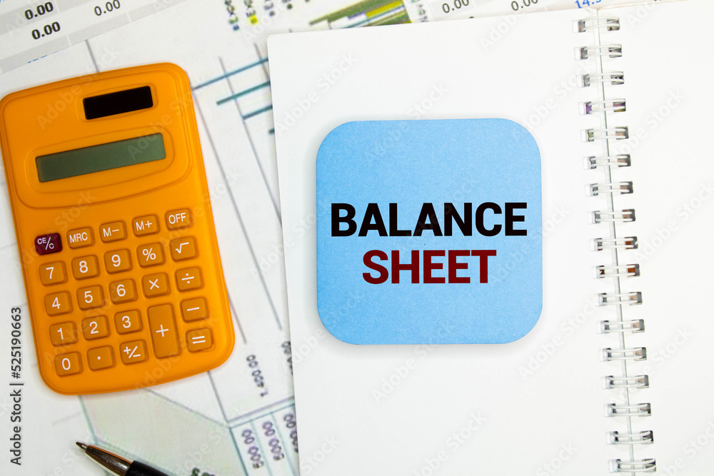 Poster clipboard with text balance sheet and keyboard and chart on white background