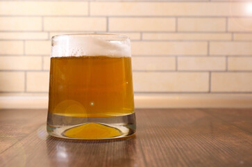 Beer. Light cold craft beer in a glass. Pint of beer close up