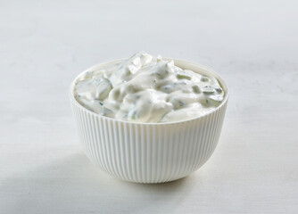 Fototapeta na wymiar bowl of sour cream or greek yogurt