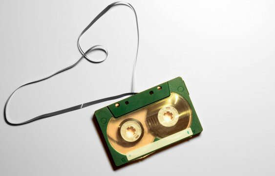 90s cassette in retro style on green background