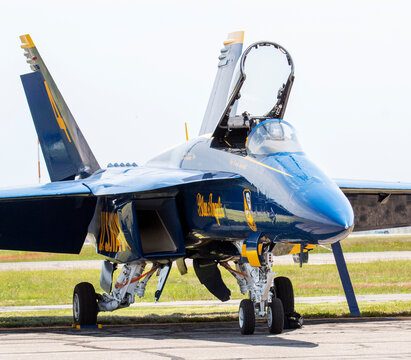 One US Navy Blue Angels jet parked with cockpit open