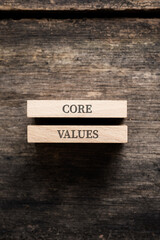 Core values sign written on two stacked wooden pegs