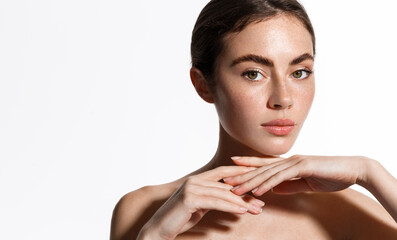 Attractive female model with natural makeup, glowing healthy skin after shower, looking sensual at...