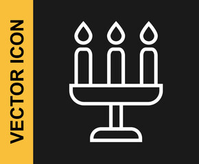 White line Candelabrum with three candlesticks icon isolated on black background. Vector
