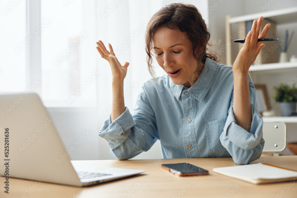 Poster furious angry evil beautiful curly businesswoman hates computer crash having problem with broken lap