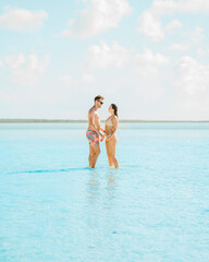 Young Couple walking on the beach. Exuma, Bahamas