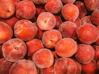 Peaches. Close up photo. Pile of sweet food on a shop counter
