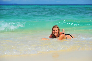  Beautiful Woman Hot Girl enjoying the Waves of the Ocean. Tropical vacation