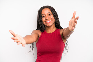 black young adult woman smiling cheerfully giving a warm, friendly, loving welcome hug, feeling happy and adorable